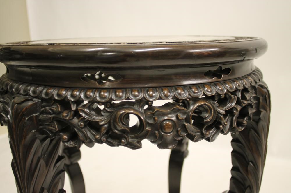 A CHINESE CARVED PADOUK WOOD JARDINIERE STAND Image