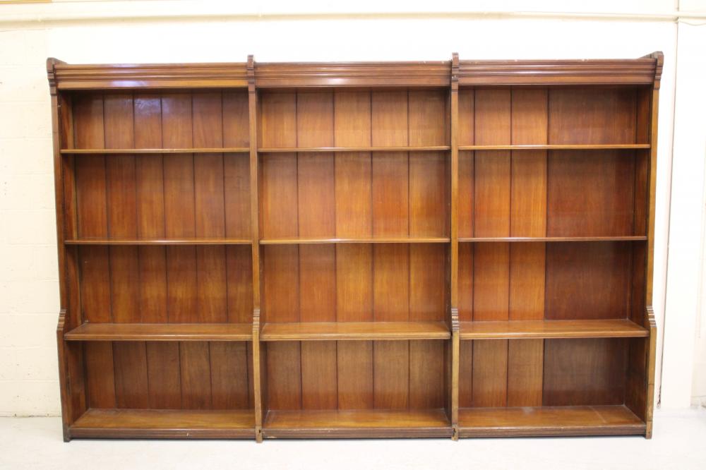 A SET OF VICTORIAN MAHOGANY OPEN BOOKSHELVES in three parts with boarded backing and adjustable Image