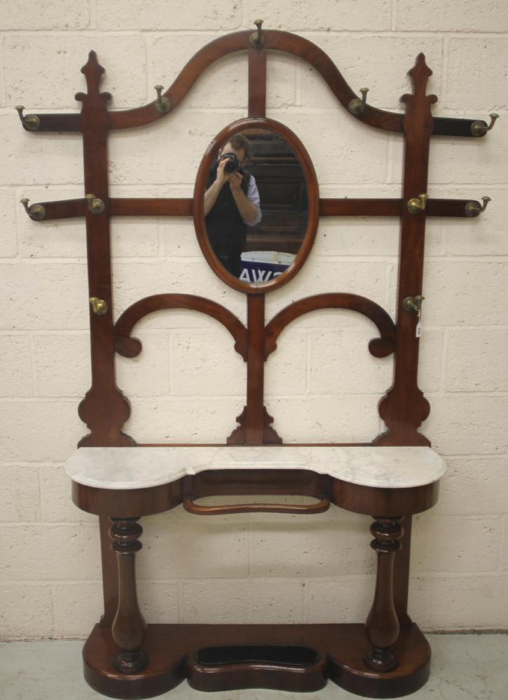 A VICTORIAN MAHOGANY HALL STAND of narrow rounded oblong form Image