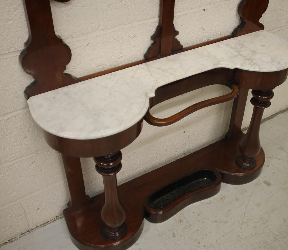 A VICTORIAN MAHOGANY HALL STAND of narrow rounded oblong form Image