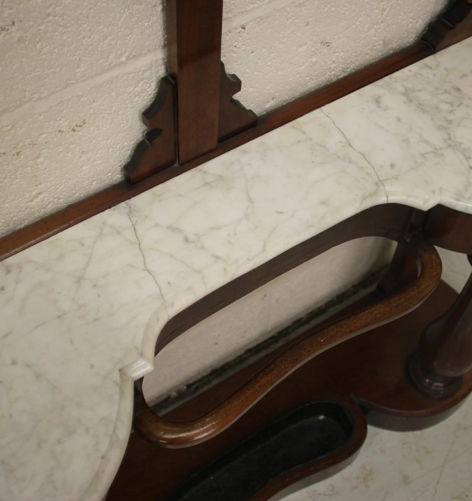 A VICTORIAN MAHOGANY HALL STAND of narrow rounded oblong form Image