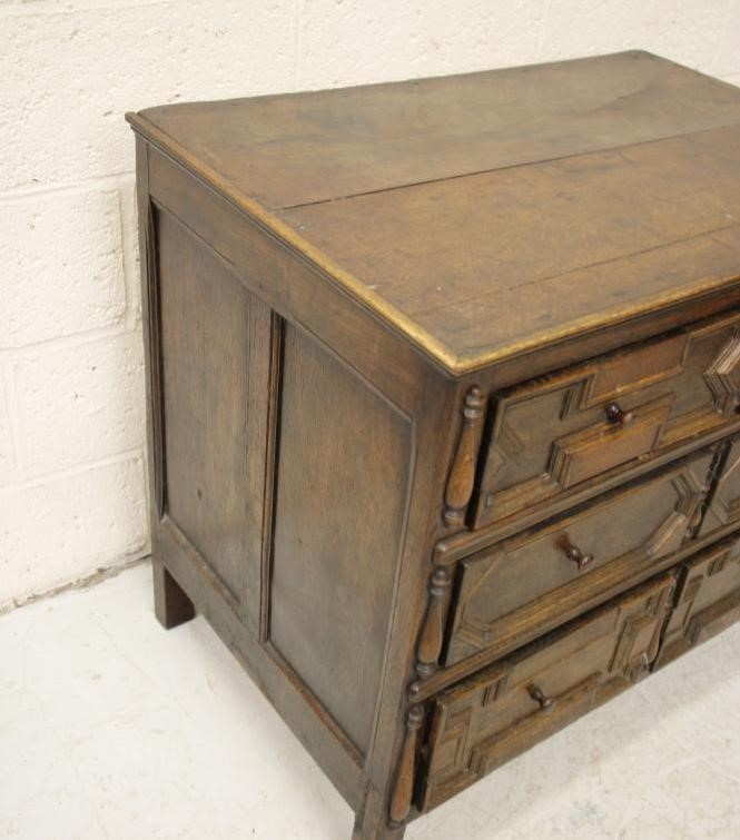 A GEOMETRICALLY MOULDED CHEST Image