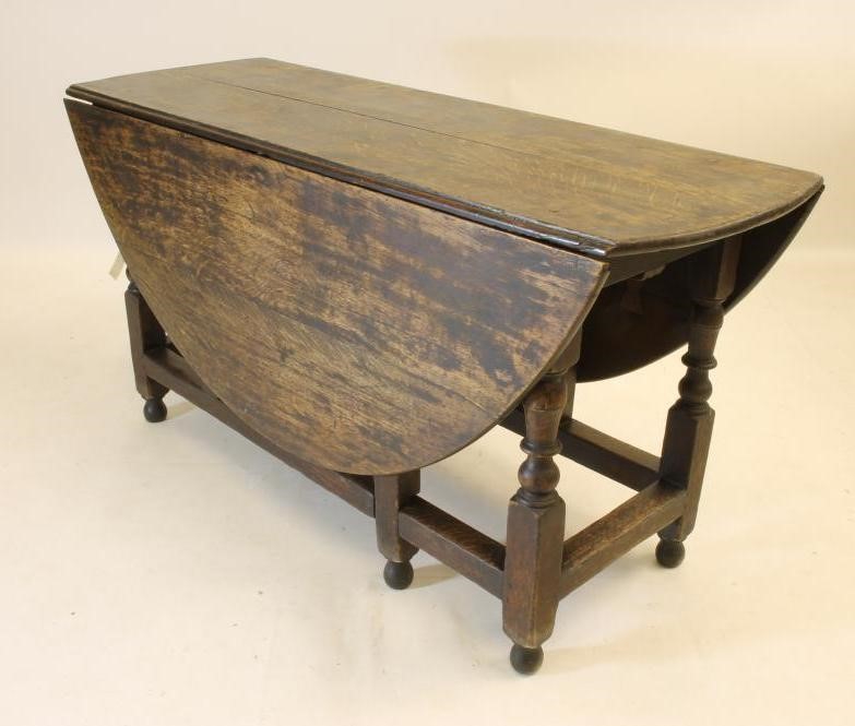 AN OAK GATELEG TABLE Image