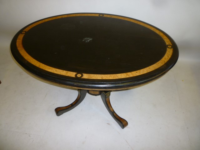 A VICTORIAN EBONOISED AND AMBOYNA LOO TABLE with gilt metal mounts Image