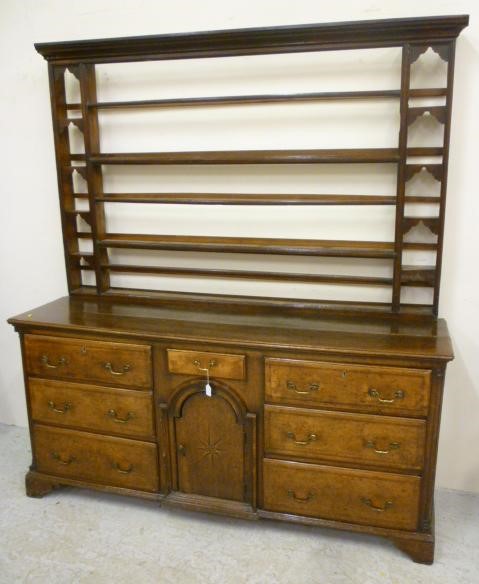 A GEORGIAN OAK ENCLOSED DRESSER Image