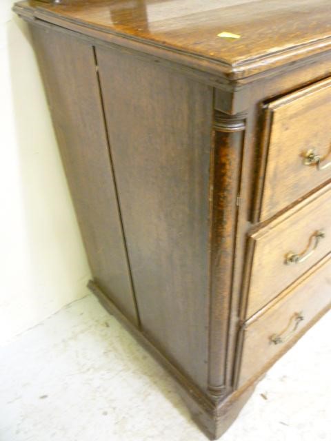 A GEORGIAN OAK ENCLOSED DRESSER Image