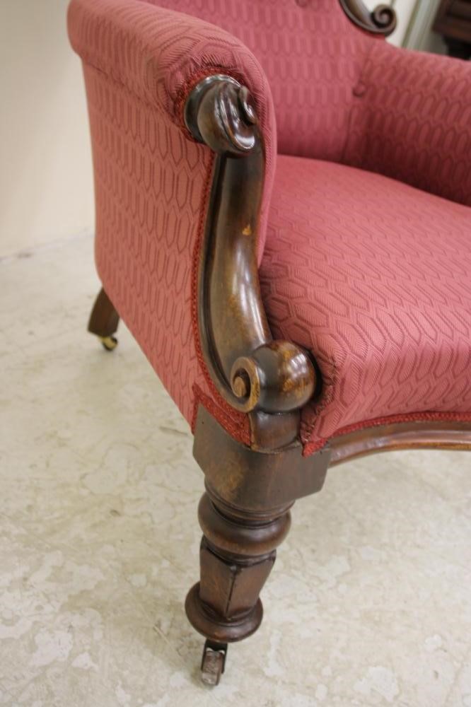 A VICTORIAN WALNUT FRAMED ARMCHAIR of spoonback form Image