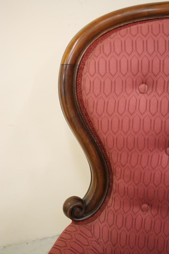 A VICTORIAN WALNUT FRAMED ARMCHAIR of spoonback form Image