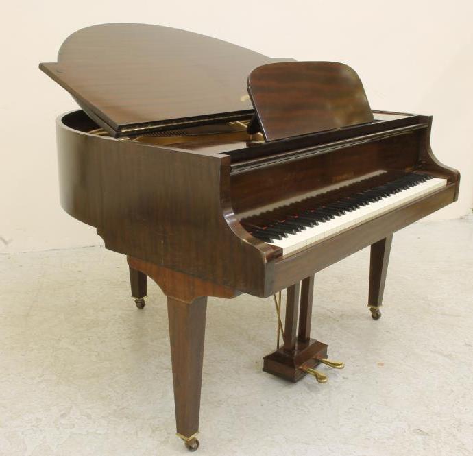 A MAHOGANY FRAMED BABY GRAND PIANO by Strohmenger Image