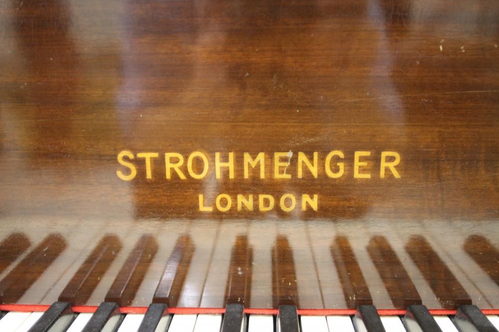 A MAHOGANY FRAMED BABY GRAND PIANO by Strohmenger Image