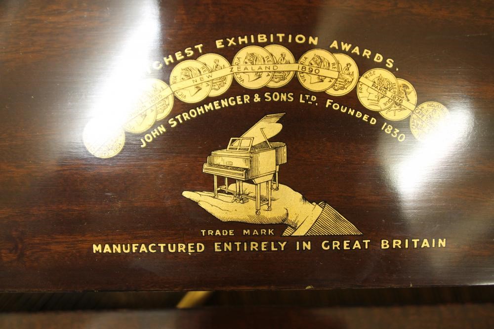 A MAHOGANY FRAMED BABY GRAND PIANO by Strohmenger Image