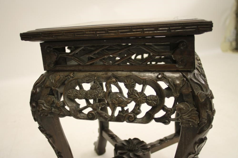 A CHINESE CARVED WOOD PLANT STAND Image