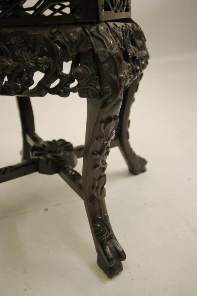 A CHINESE CARVED WOOD PLANT STAND Image