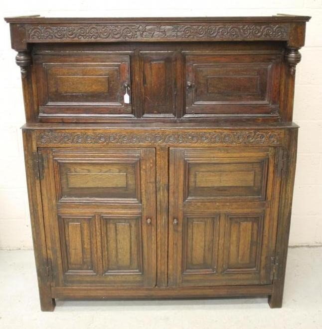 AN OAK PRESS CUPBOARD Image