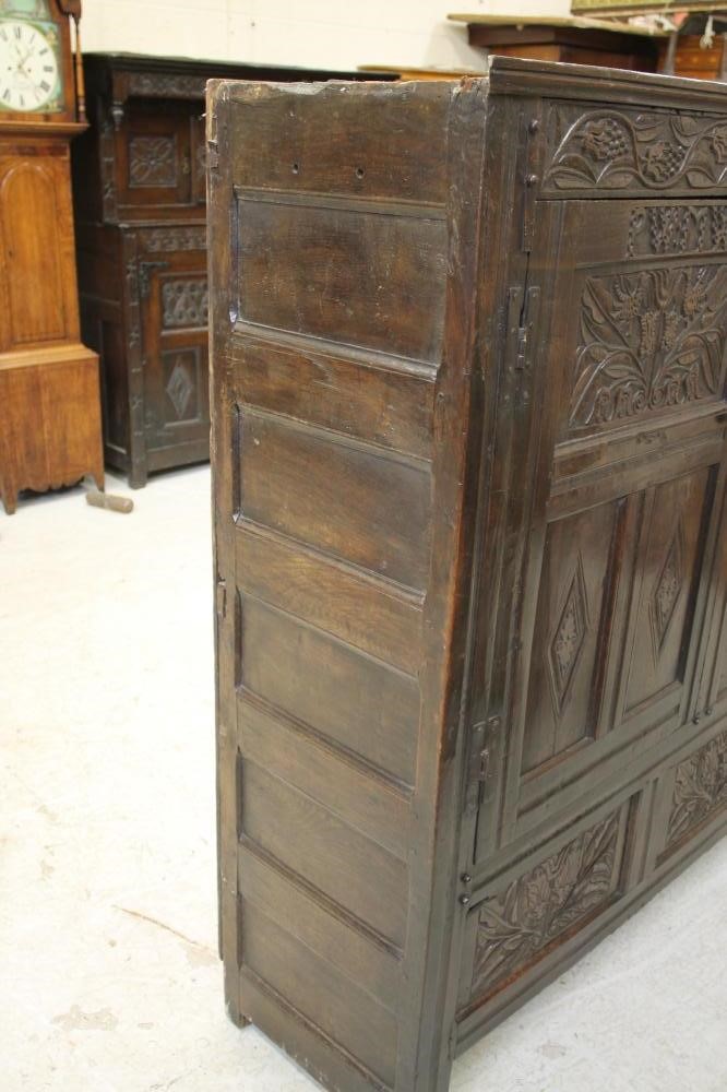 AN OAK LIVERY CUPBOARD Image