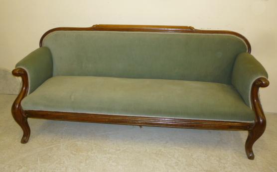 A VICTORIAN WALNUT FRAMED CLUB SOFA upholstered in pale green velvet Image