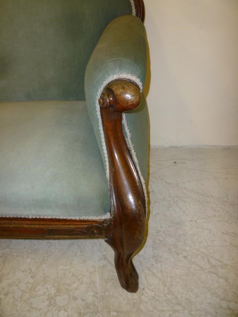 A VICTORIAN WALNUT FRAMED CLUB SOFA upholstered in pale green velvet Image