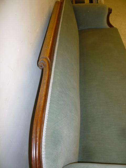 A VICTORIAN WALNUT FRAMED CLUB SOFA upholstered in pale green velvet Image