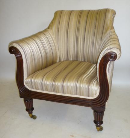 A GEORGE IV MAHOGANY FRAMED LIBRARY CHAIR upholstered in striped cream and brown silk Image