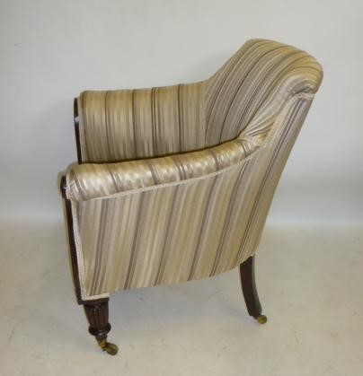 A GEORGE IV MAHOGANY FRAMED LIBRARY CHAIR upholstered in striped cream and brown silk Image