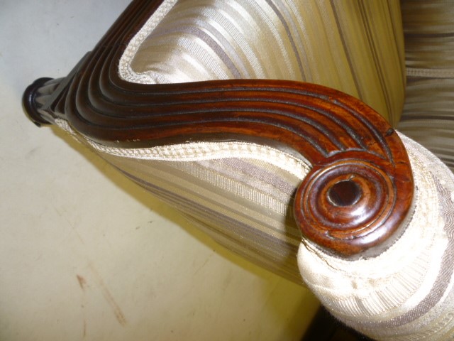 A GEORGE IV MAHOGANY FRAMED LIBRARY CHAIR upholstered in striped cream and brown silk Image