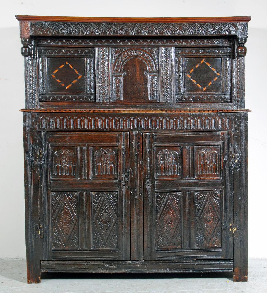 AN OAK PRESS CUPBOARD Image