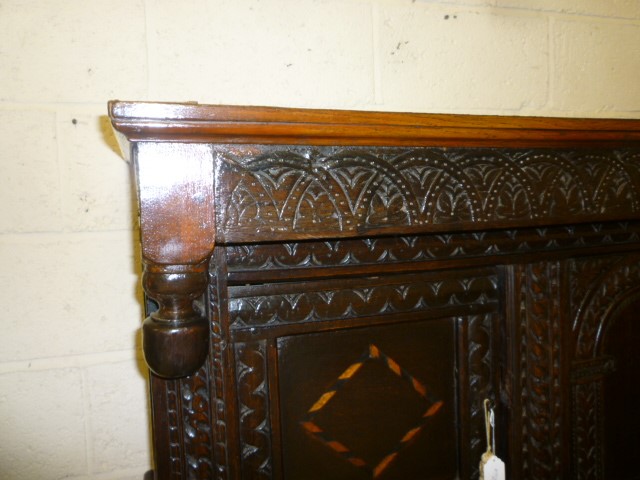 AN OAK PRESS CUPBOARD Image