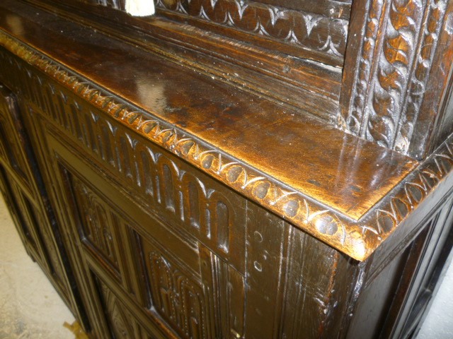 AN OAK PRESS CUPBOARD Image