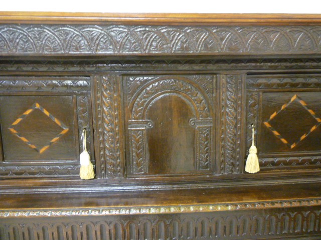 AN OAK PRESS CUPBOARD Image