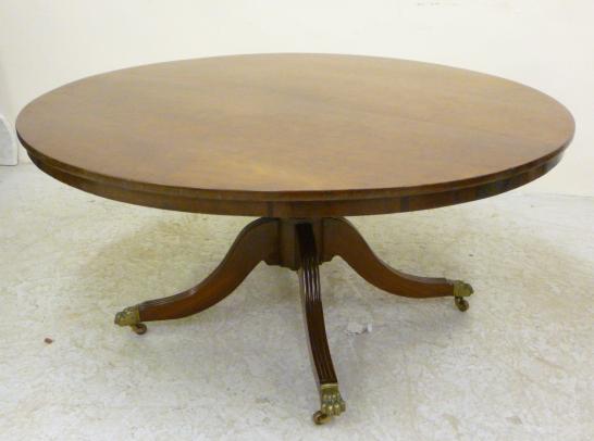 A PLUM PUDDING MAHOGANY BREAKFAST TABLE Image