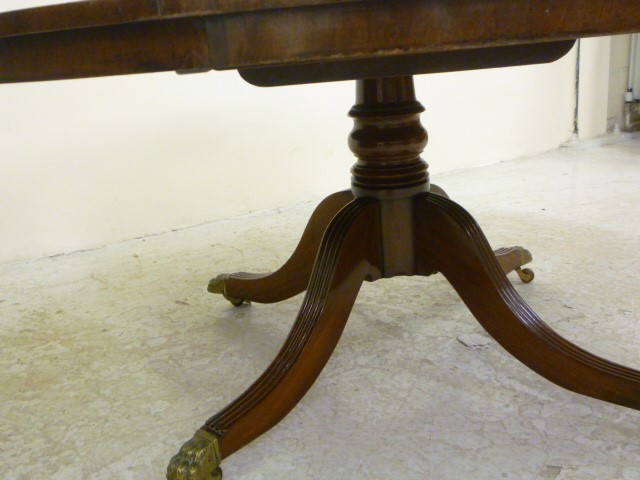 A PLUM PUDDING MAHOGANY BREAKFAST TABLE Image