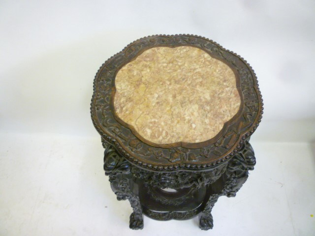 AN ORIENTAL PADOUK WOOD JARDINIERE STAND Image