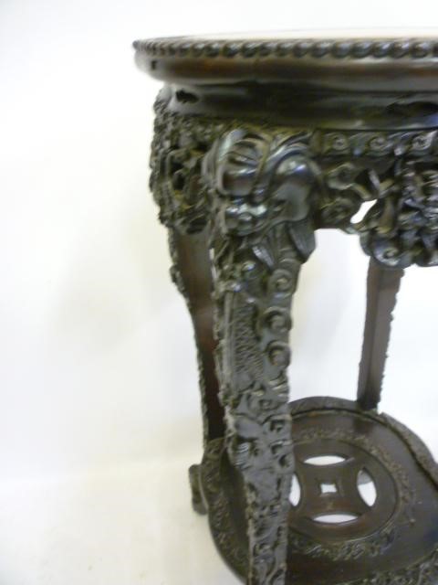 AN ORIENTAL PADOUK WOOD JARDINIERE STAND Image