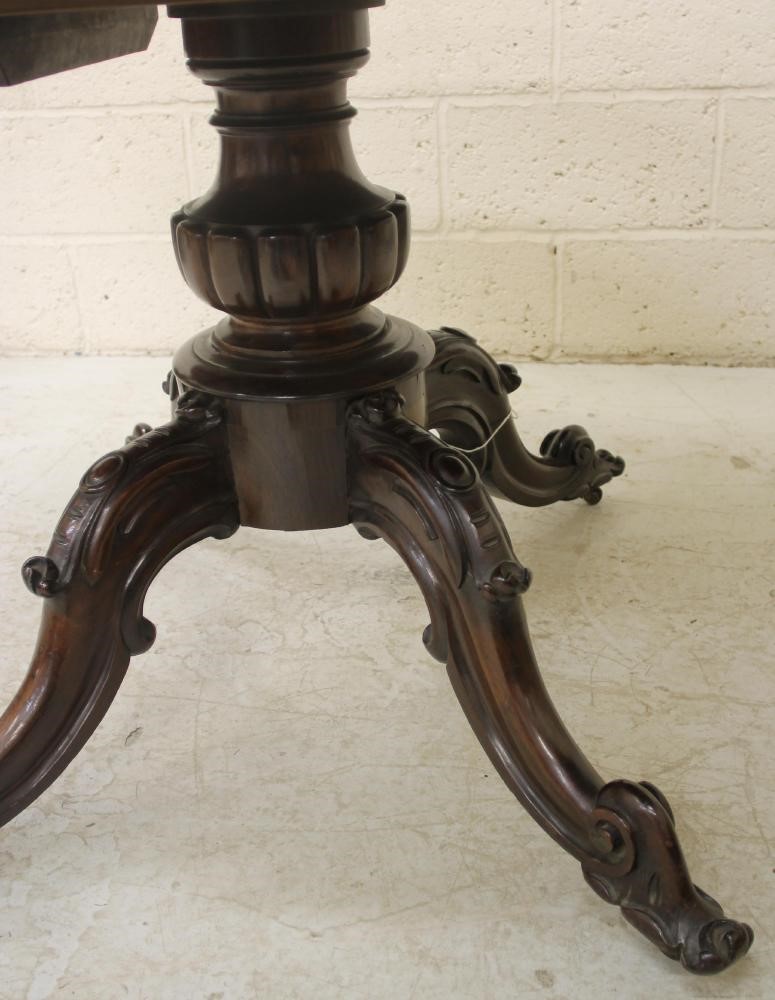 A VICTORIAN ROSEWOOD BREAKFAST TABLE Image