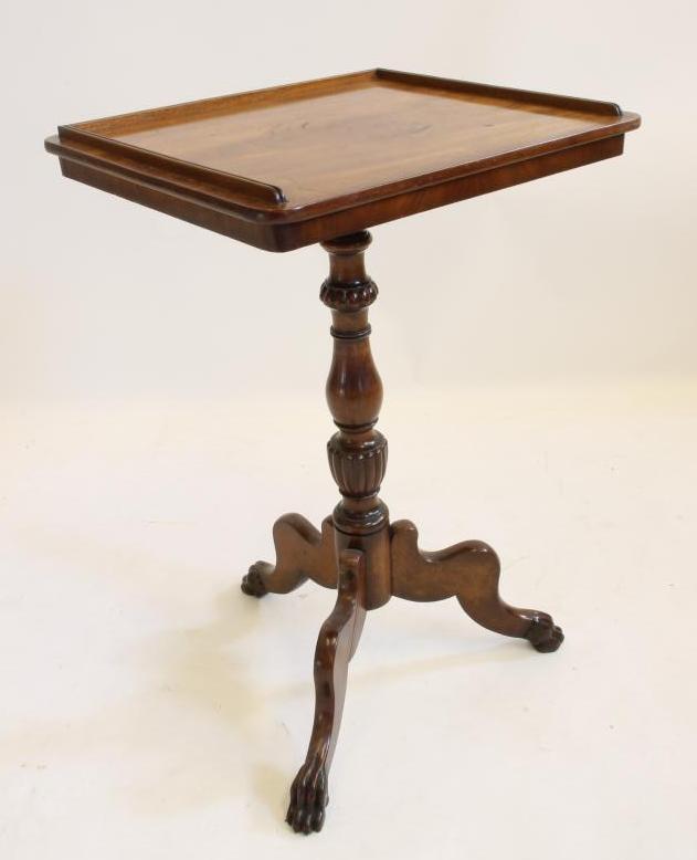 AN EARLY VICTORIAN MAHOGANY TRIPOD TABLE of rounded oblong form with three quarter gallery Image