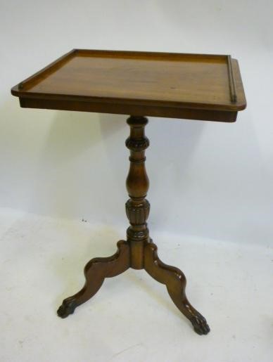 AN EARLY VICTORIAN MAHOGANY TRIPOD TABLE of rounded oblong form with three quarter gallery Image