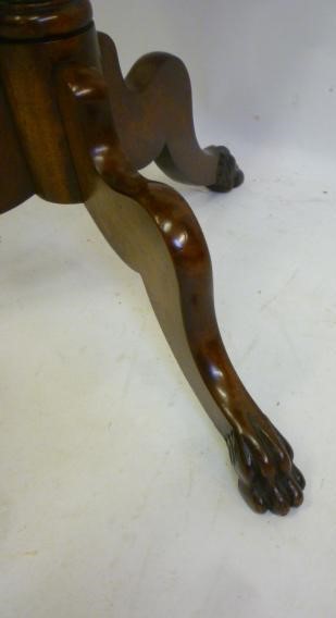 AN EARLY VICTORIAN MAHOGANY TRIPOD TABLE of rounded oblong form with three quarter gallery Image