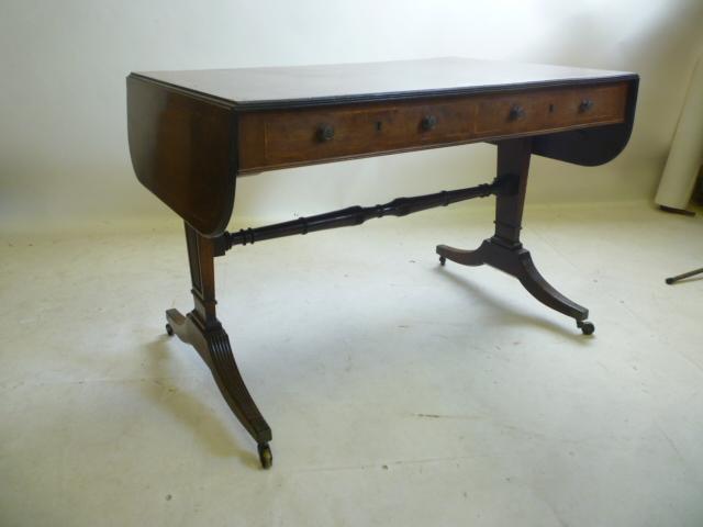 A MAHOGANY SOFA TABLE Image