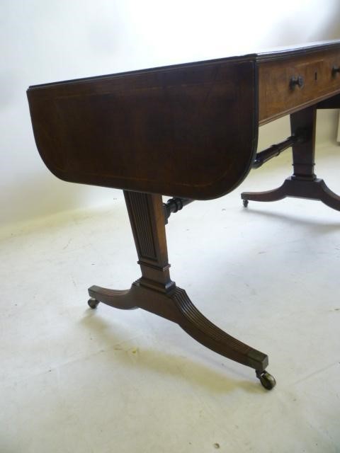 A MAHOGANY SOFA TABLE Image
