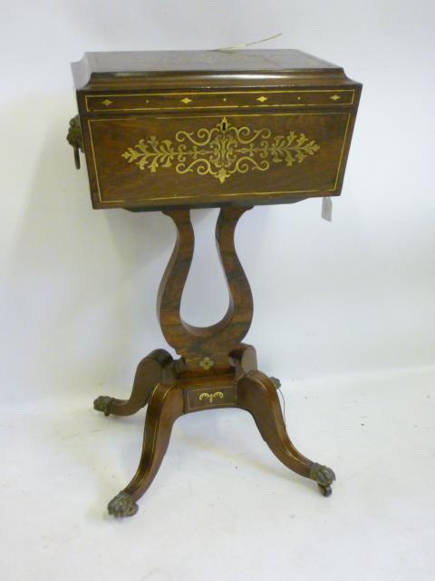 A REGENCY ROSEWOOD AND BRASS INLAID TEAPOY of sarcophagus form Image