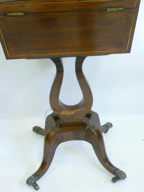 A REGENCY ROSEWOOD AND BRASS INLAID TEAPOY of sarcophagus form Image