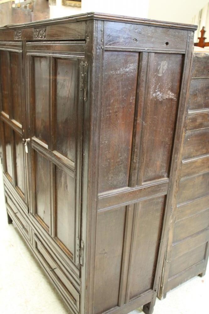 A QUEEN ANNE OAK LIVERY CUPBOARD Image