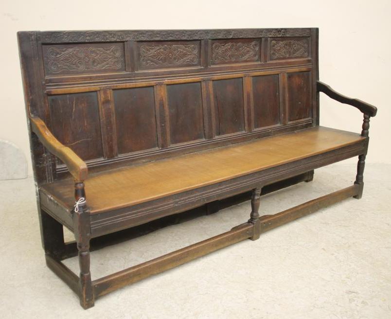 A GEORGE III OAK SETTLE Image