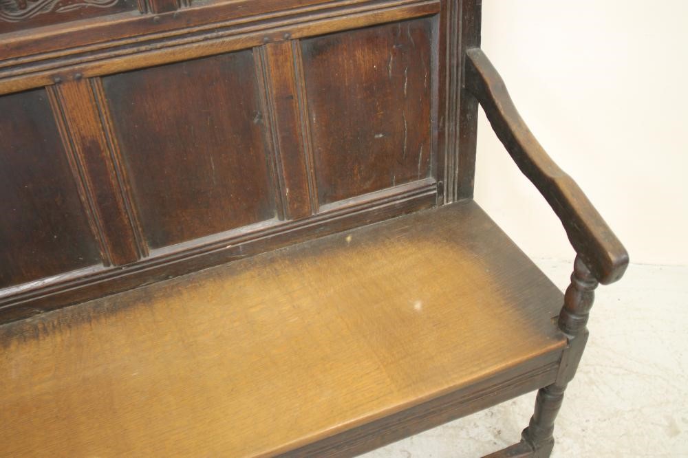 A GEORGE III OAK SETTLE Image