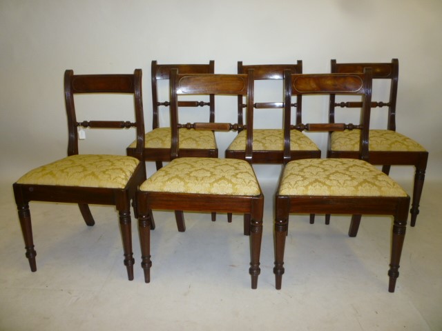 A SET OF SIX REGENCY MAHOGANY DINING CHAIRS with brass stringing Image