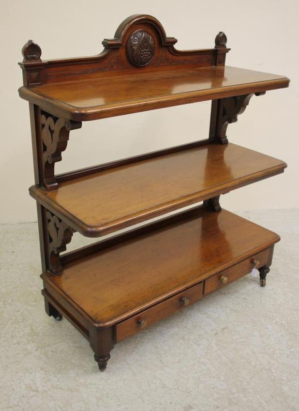 A VICTORIAN MAHOGANY THREE TIER BUFFET of rounded oblong form Image