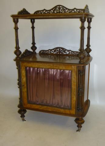 A VICTORIAN WALNUT MUSIC CABINET of rounded oblong form Image