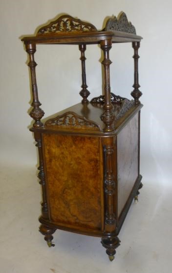 A VICTORIAN WALNUT MUSIC CABINET of rounded oblong form Image