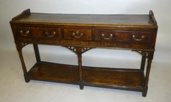 A VICTORIAN WALNUT MUSIC CABINET of rounded oblong form Image