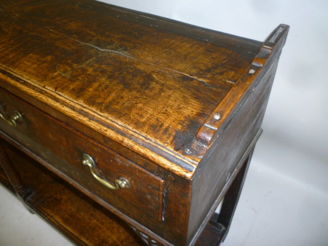 A VICTORIAN WALNUT MUSIC CABINET of rounded oblong form Image